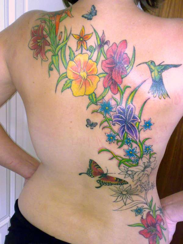 illustrated man tattoo studio tattoo on back shoulder